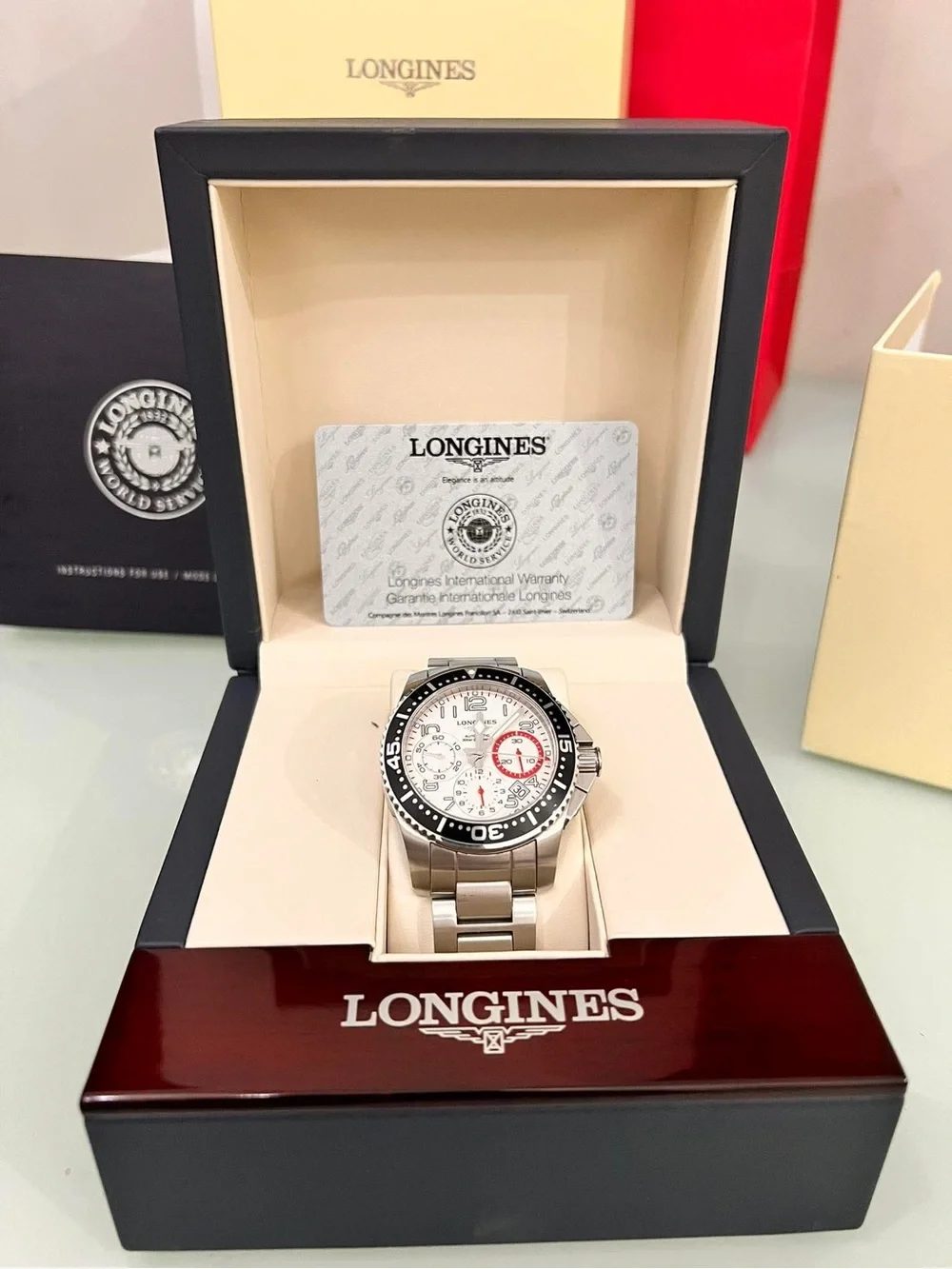 Longines Silver Steel Chronograph Watch with White Dial and Black Bezel